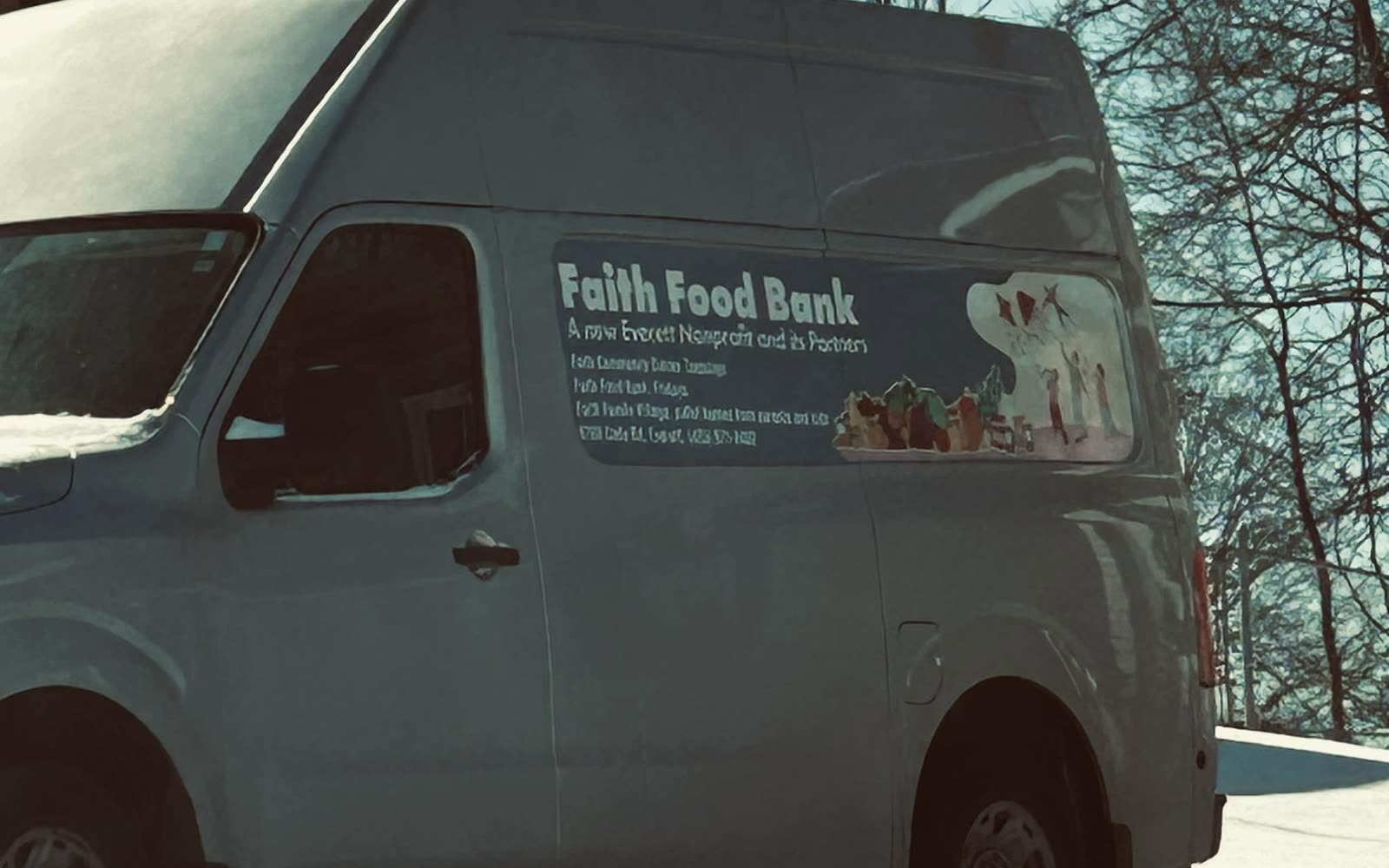 The original Faith Food Bank van in Everett, Washington, parked in snow with the food bank's name on the side
